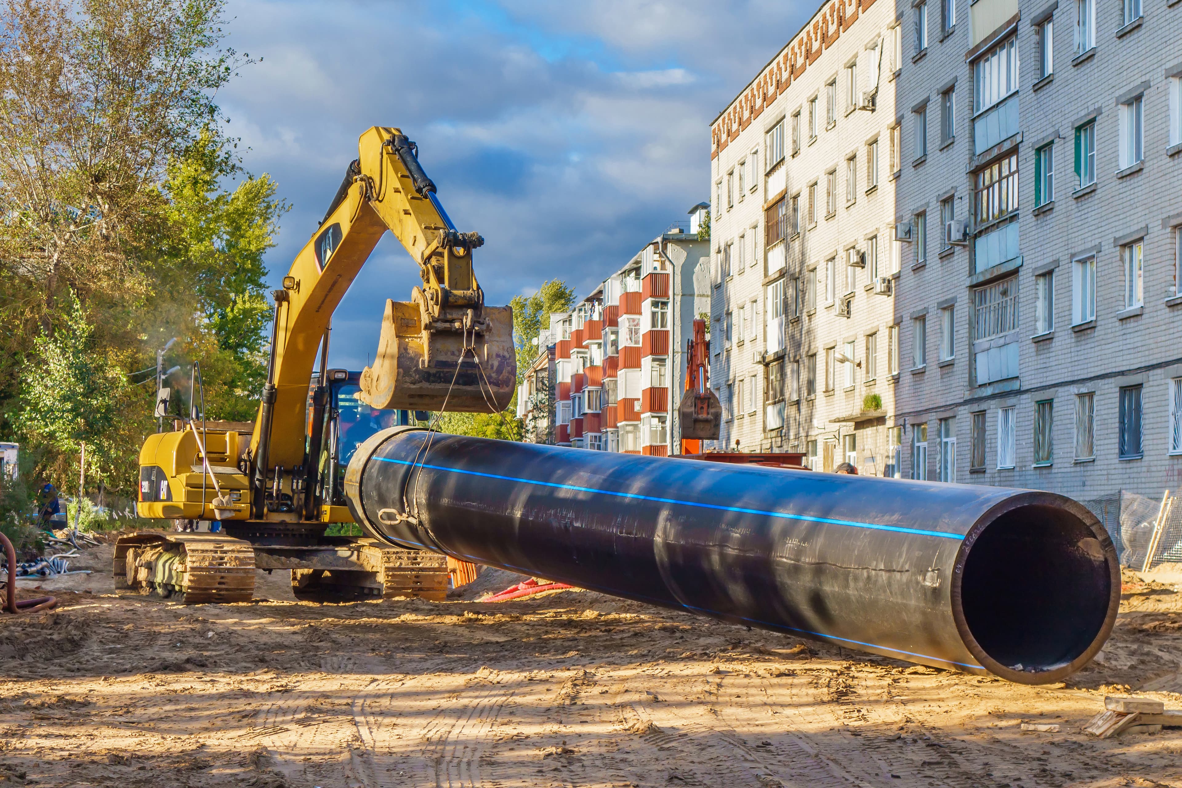 Heavy excavator machinery on a commercial dig site